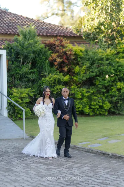 Bride Mariana walking down the aisle at Celeiro Blanc