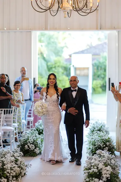 Bride Mariana walking down the aisle at Celeiro Blanc