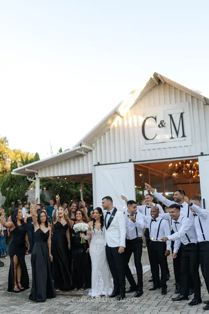 Couple with the wedding party at Celeiro Blanc