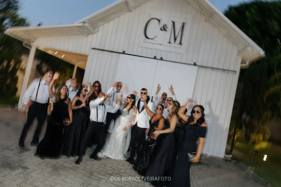 Couple with the wedding party at Celeiro Blanc