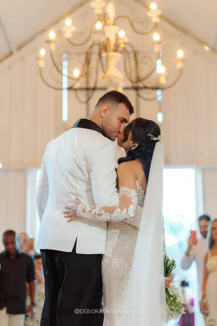 Newlyweds leaving the ceremony through sparklers at Celeiro Blanc