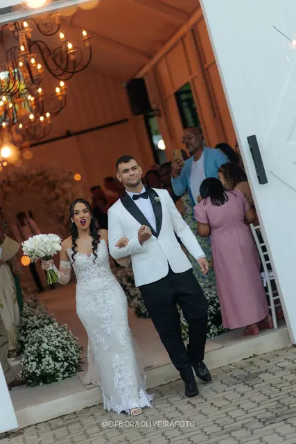 Newlyweds leaving the ceremony through sparklers at Celeiro Blanc