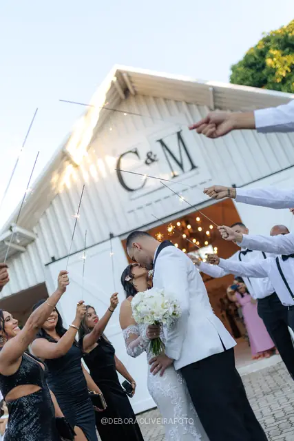 Newlyweds leaving the ceremony through sparklers at Celeiro Blanc