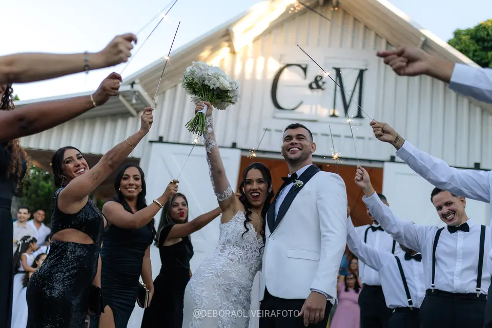Newlyweds leaving the ceremony through sparklers at Celeiro Blanc