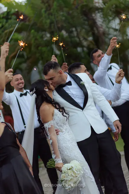 Newlyweds leaving the ceremony through sparklers at Celeiro Blanc
