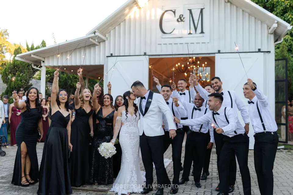 Newlyweds leaving the ceremony through sparklers at Celeiro Blanc