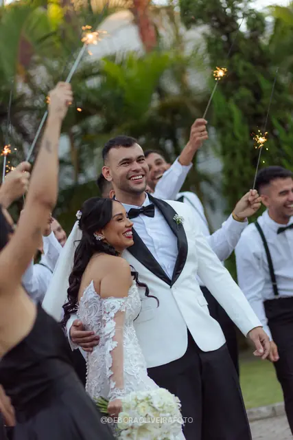 Newlyweds leaving the ceremony through sparklers at Celeiro Blanc