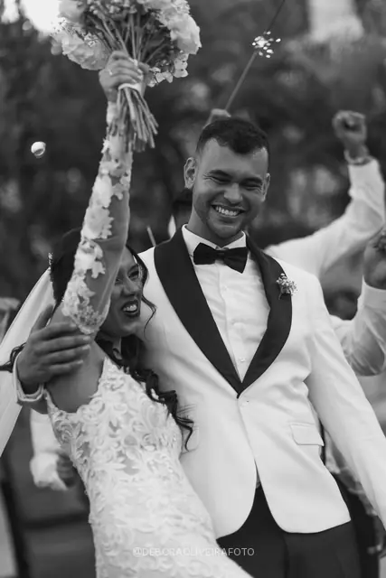 Newlyweds leaving the ceremony through sparklers at Celeiro Blanc